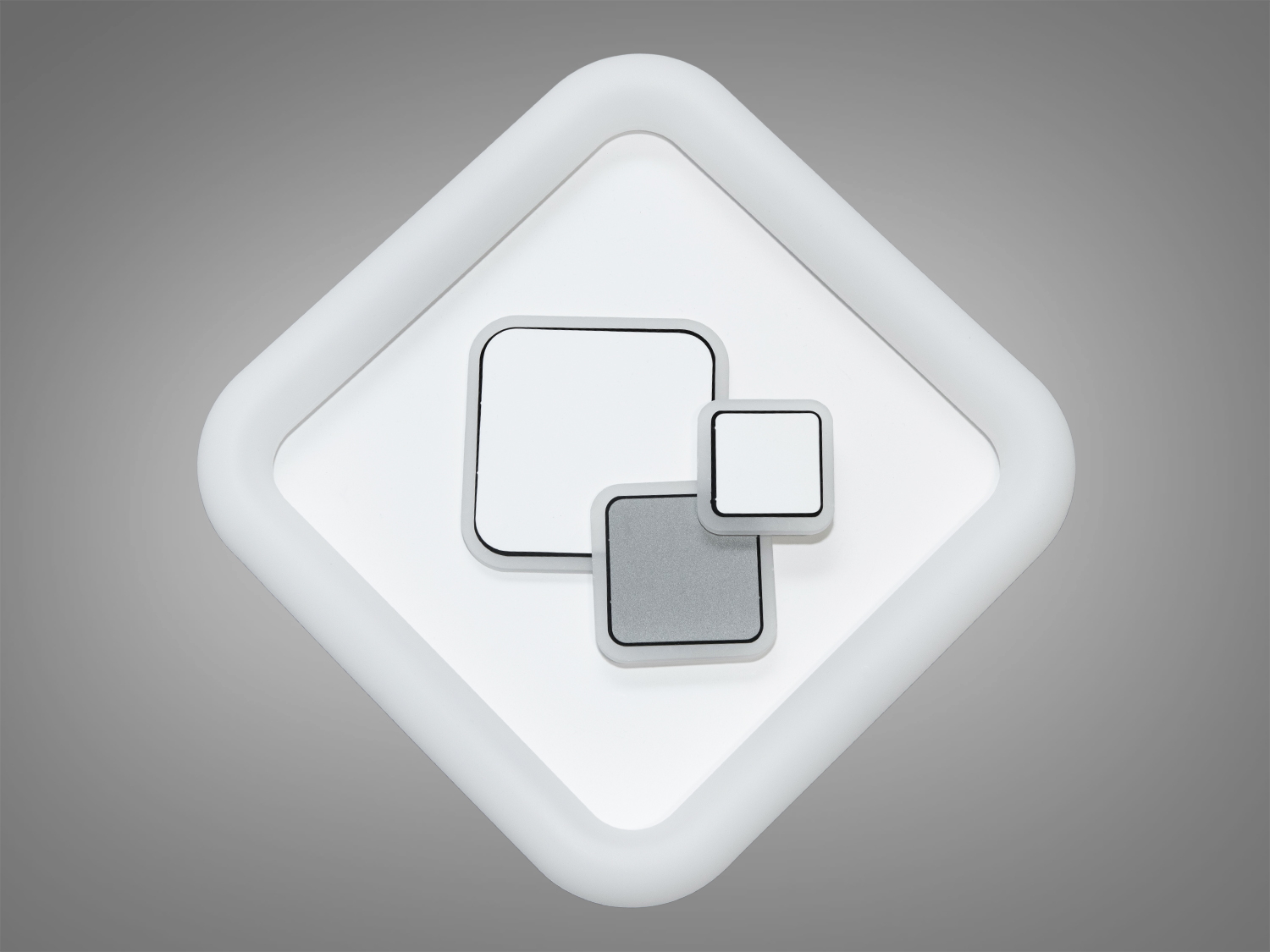 Світильник квадратної форми з білим обрамленням. Центральні елементи різних розмірів створюють сучасний дизайн для домашнього інтер’єру.