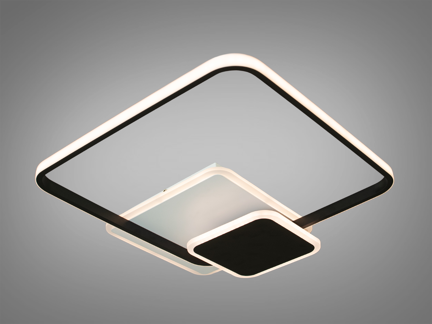 Стельовий світильник квадратної форми з чорними і білими елементами, підходить для сучасного інтер′єру.