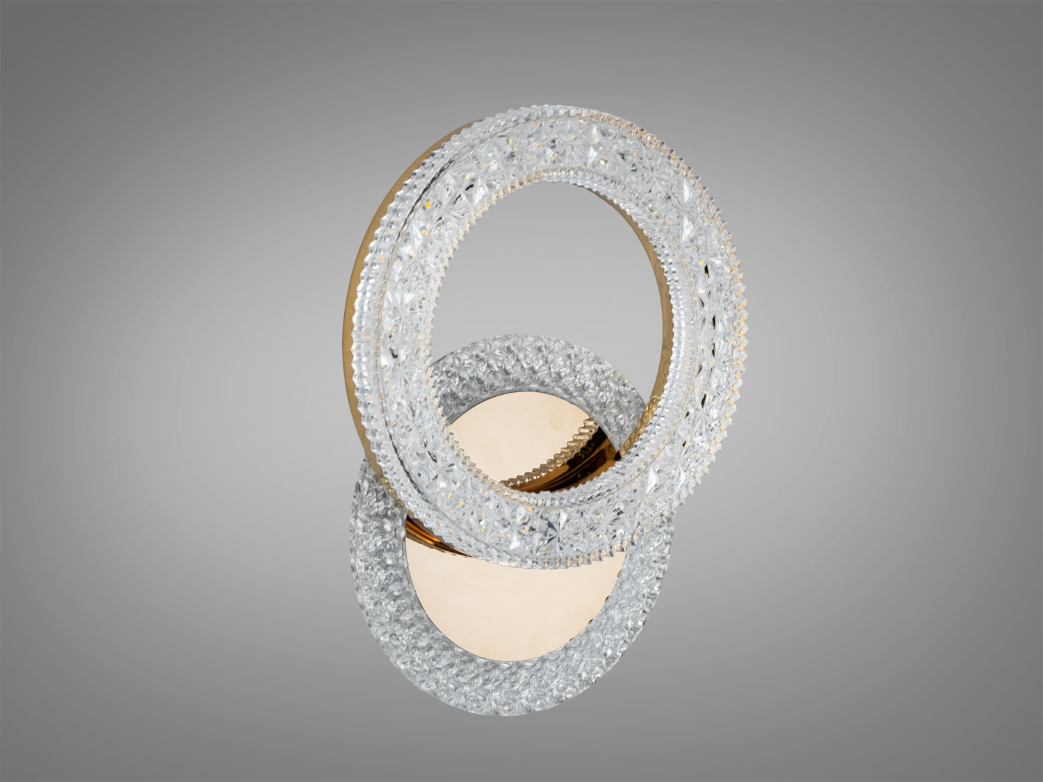 Настінний світильник у формі двох кілець з прозорим дизайном, підходить для будь-якого інтер’єру, забезпечуючи м’яке розсіяне освітлення.