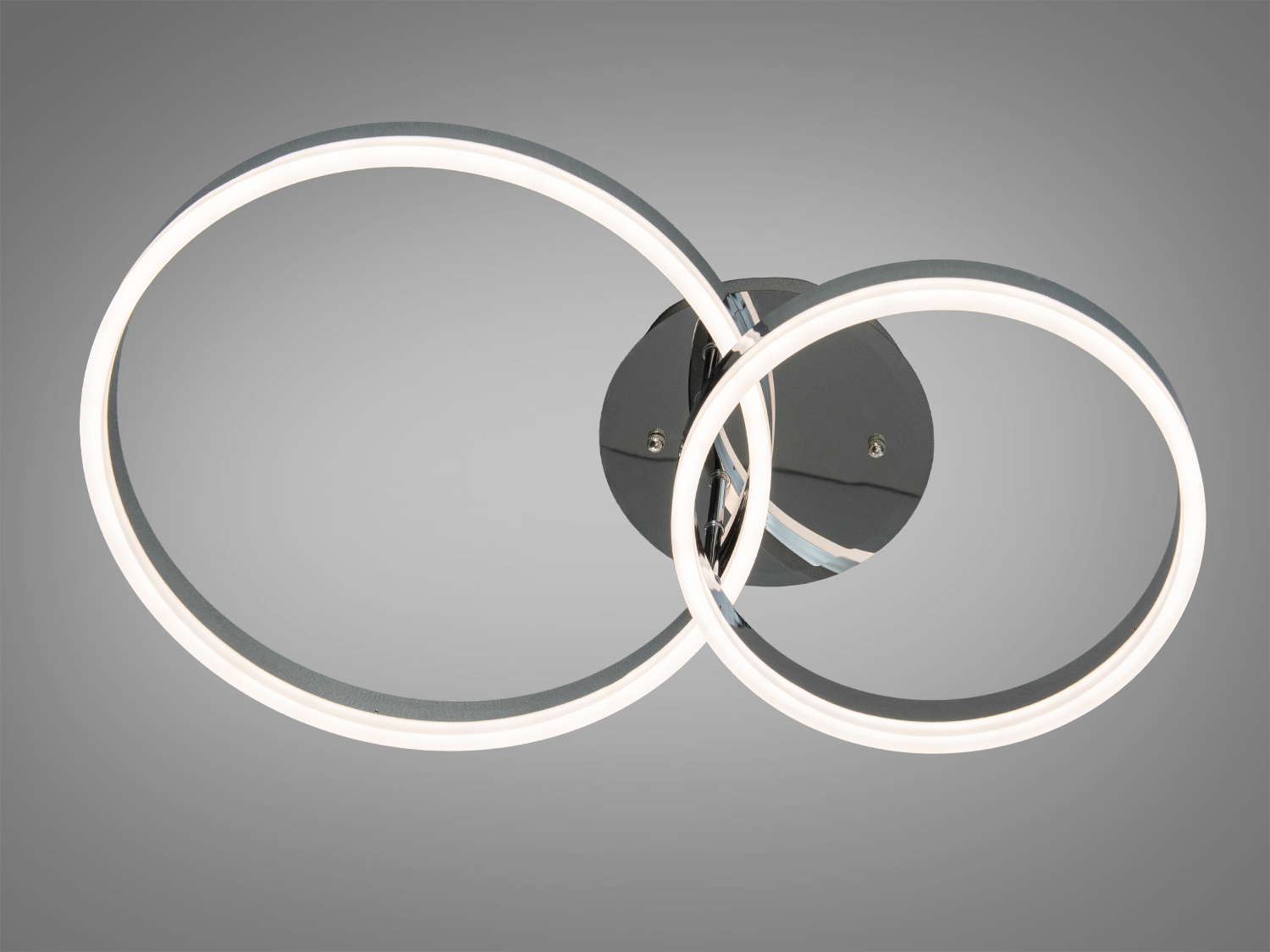 Настінний світильник з двома круглими LED кільцями, що перетинаються, підходить для сучасного інтер′єру.