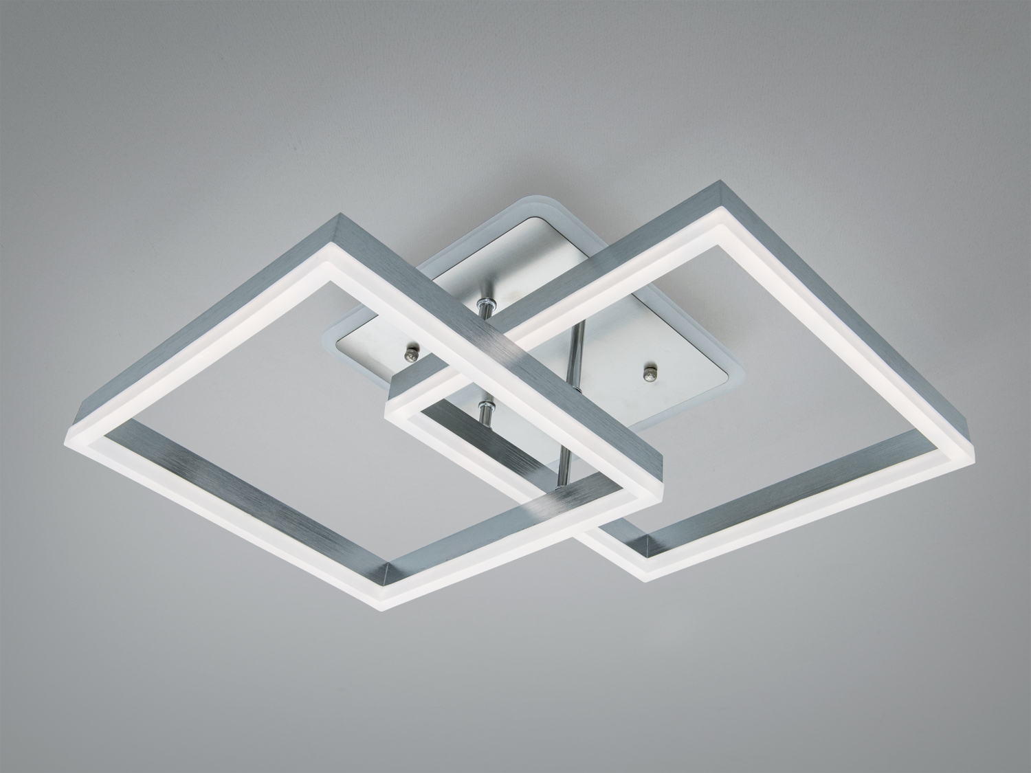 Стельовий світильник у формі двох квадратів з металевою основою. Підходить для сучасного інтер’єру, забезпечує рівномірне освітлення.