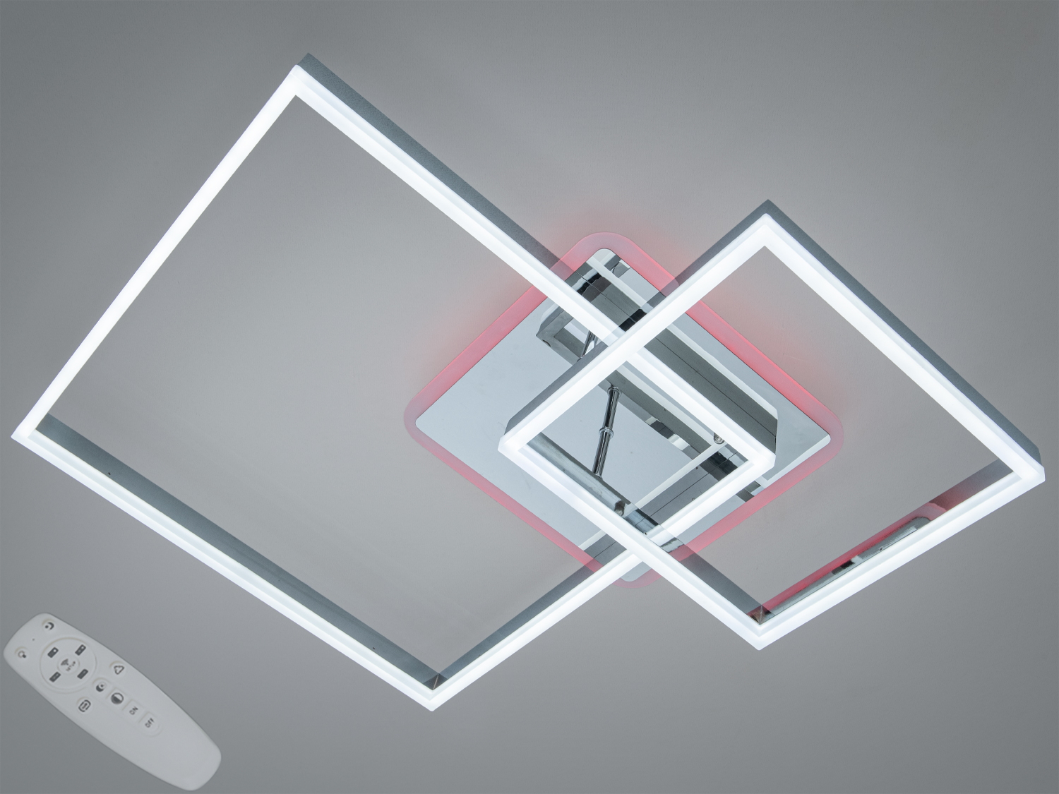 Світлодіодний світильник з дистанційним керуванням, має два пересічні квадратні елементи з білим світлом.
