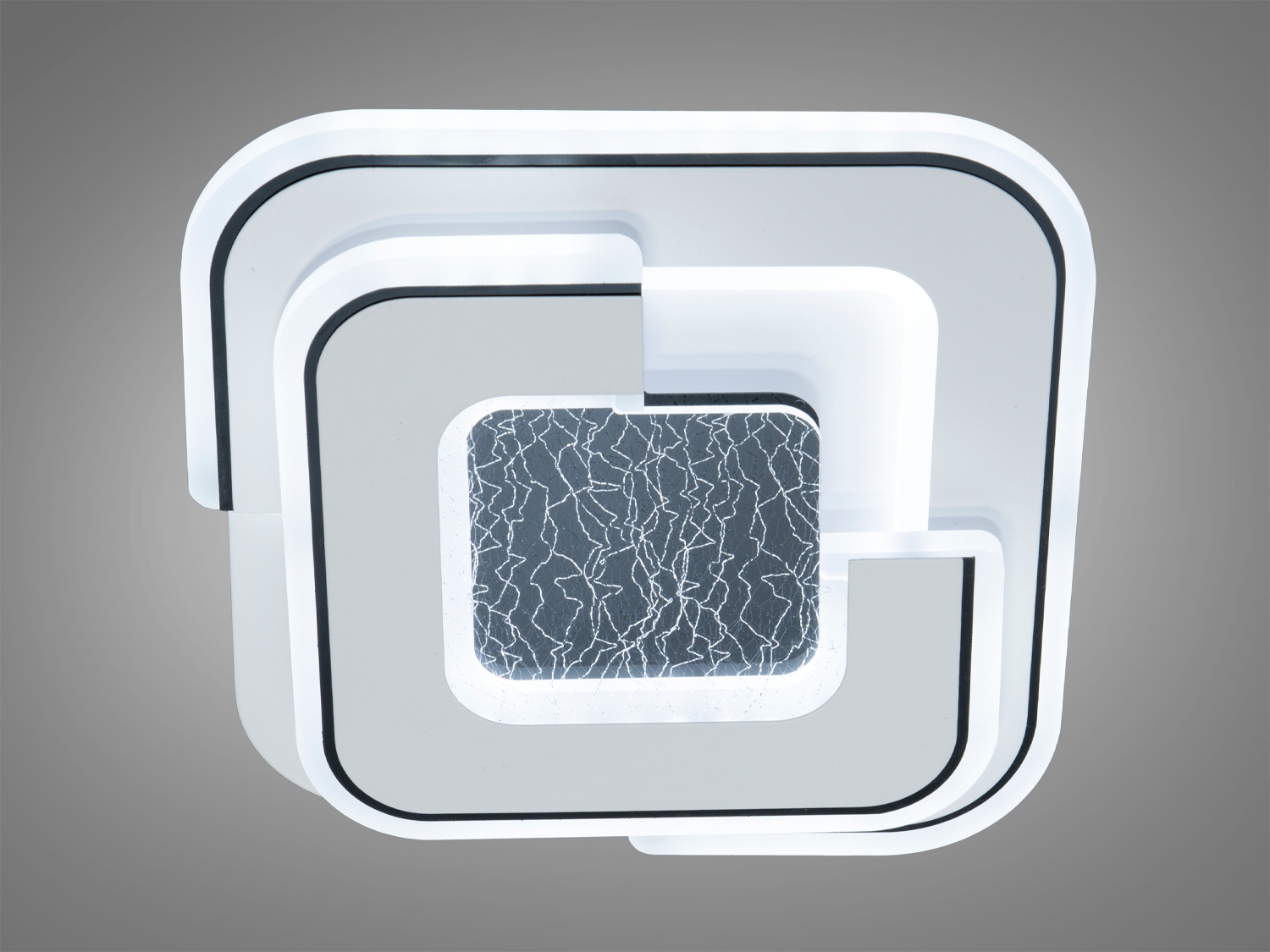 Світильник з білим підсвічуванням та чорним візерунком у центрі. Ідеальний для стильного інтер’єру.