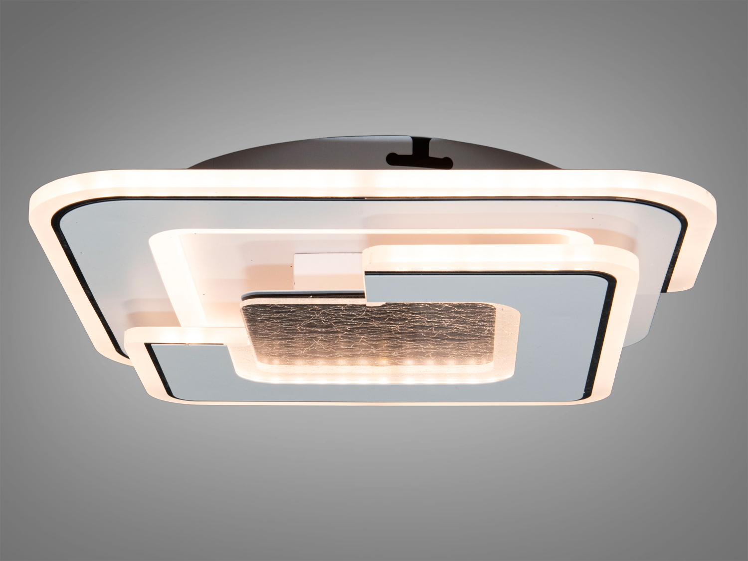 Стельовий світильник з м’яким білим світлом, квадратний дизайн з чорними акцентами, підходить для вітальні або спальні.