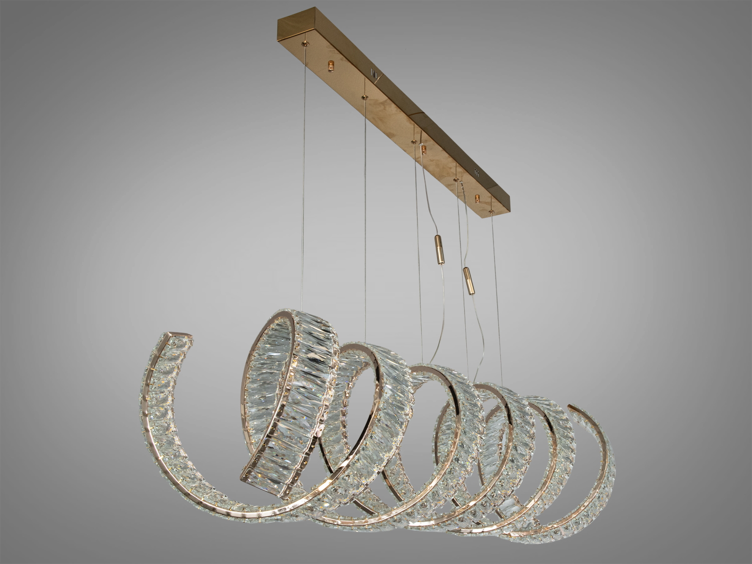 Підвісний світильник зі спіральним дизайном, виготовлений з прозорого матеріалу. Ідеально підходить для сучасного інтер’єру.