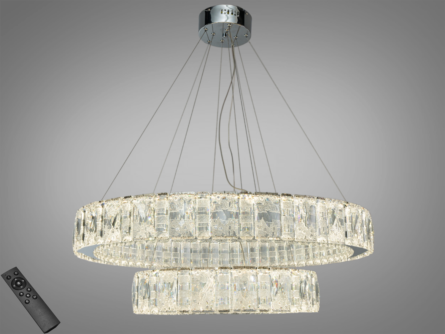 Кругла підвісна люстра з кришталевими елементами, оснащена пультом дистанційного керування. Підходить для сучасних інтер′єрів.