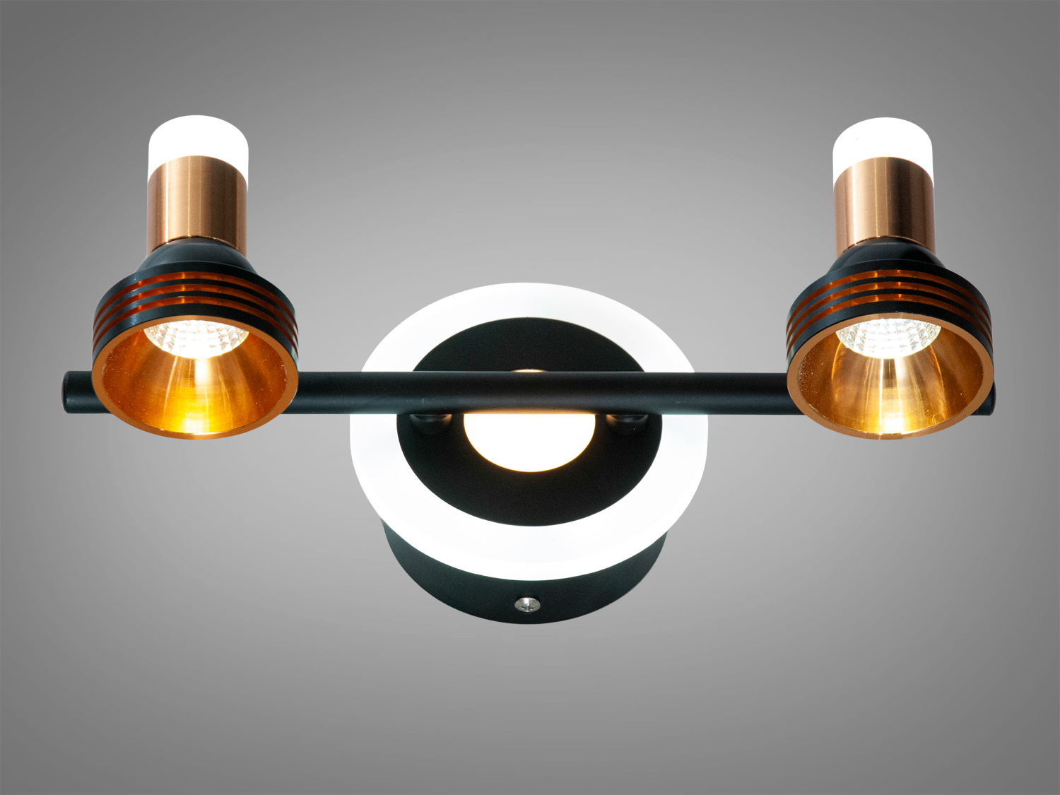 Двоголовий світильник з круглою основою, чорний корпус, золоті та мідні акценти. Вбудоване LED підсвічування додає функціональності.