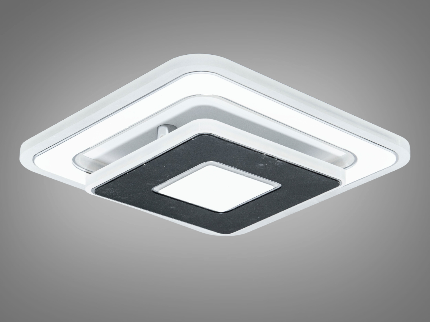 Сучасний квадратний світильник з чорними та білими деталями, підходить для монтажу на стелі, створює стильний акцент у приміщенні.