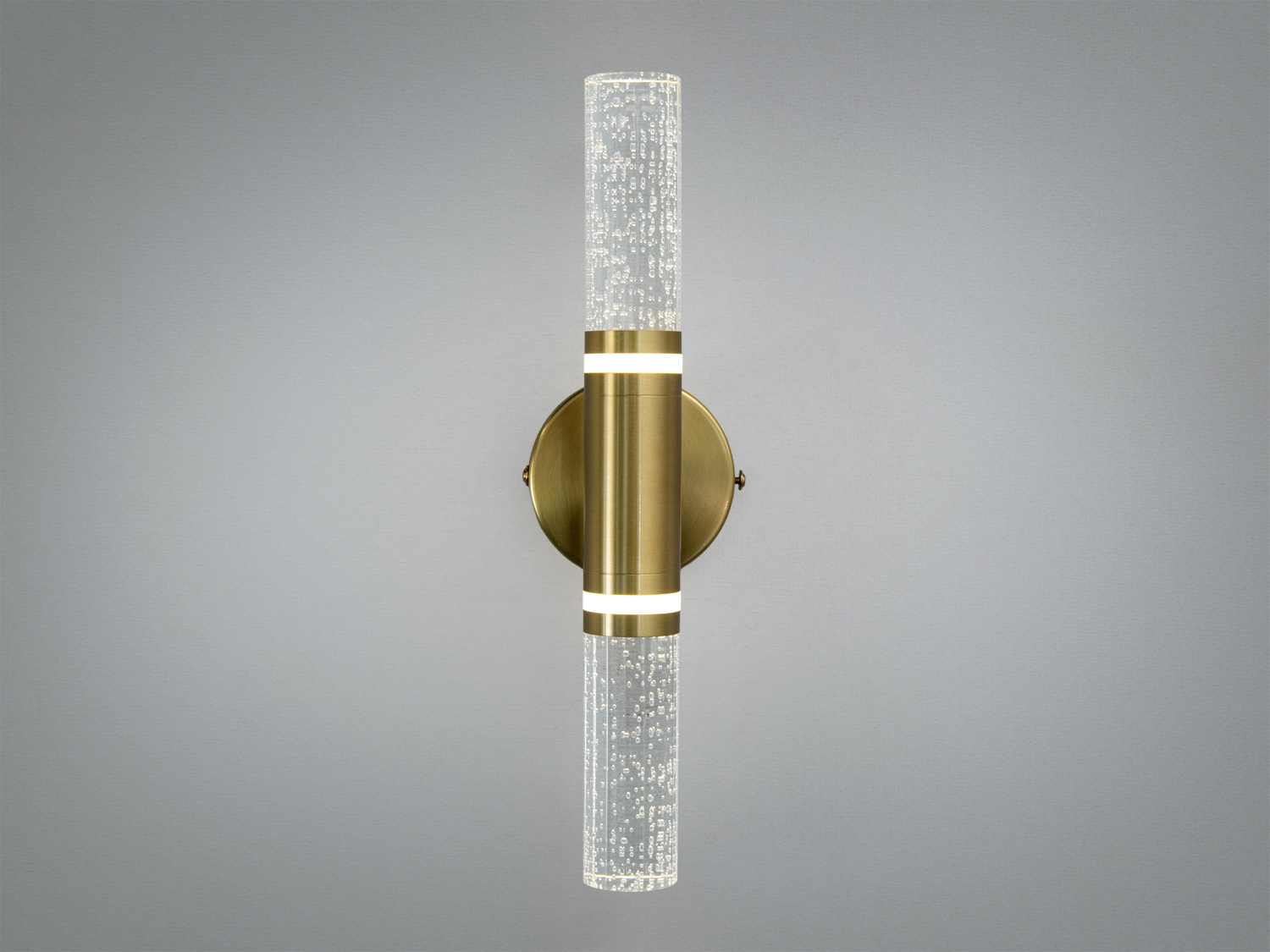 Світильник для стіни з подвійними прозорими циліндрами, що імітують бульбашки. Золотистий корпус, підходить для ванних кімнат.