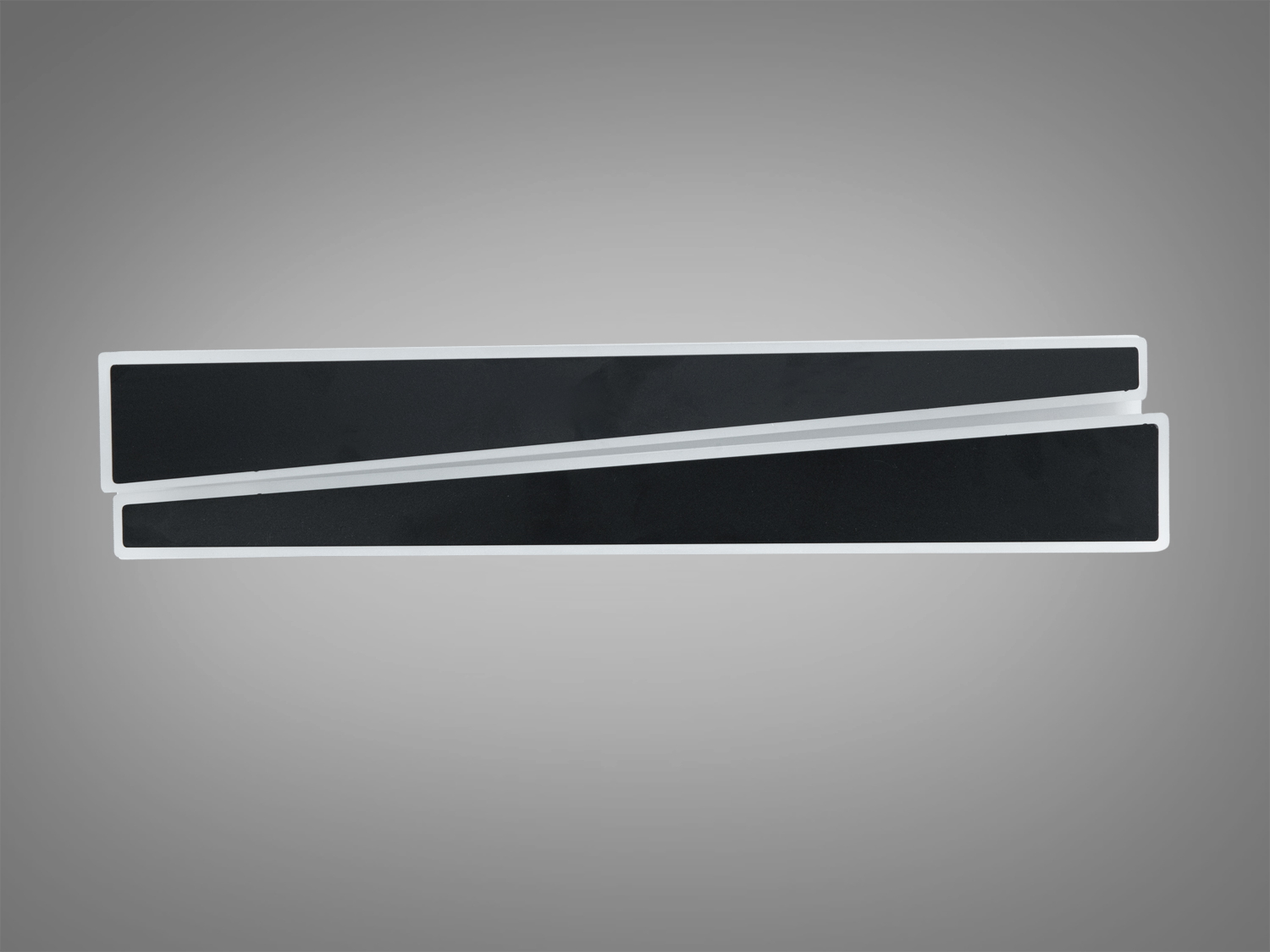 Два паралельних чорних прямокутника з білими рамками, розташовані на сірому фоні, підходять для сучасного інтер’єру.