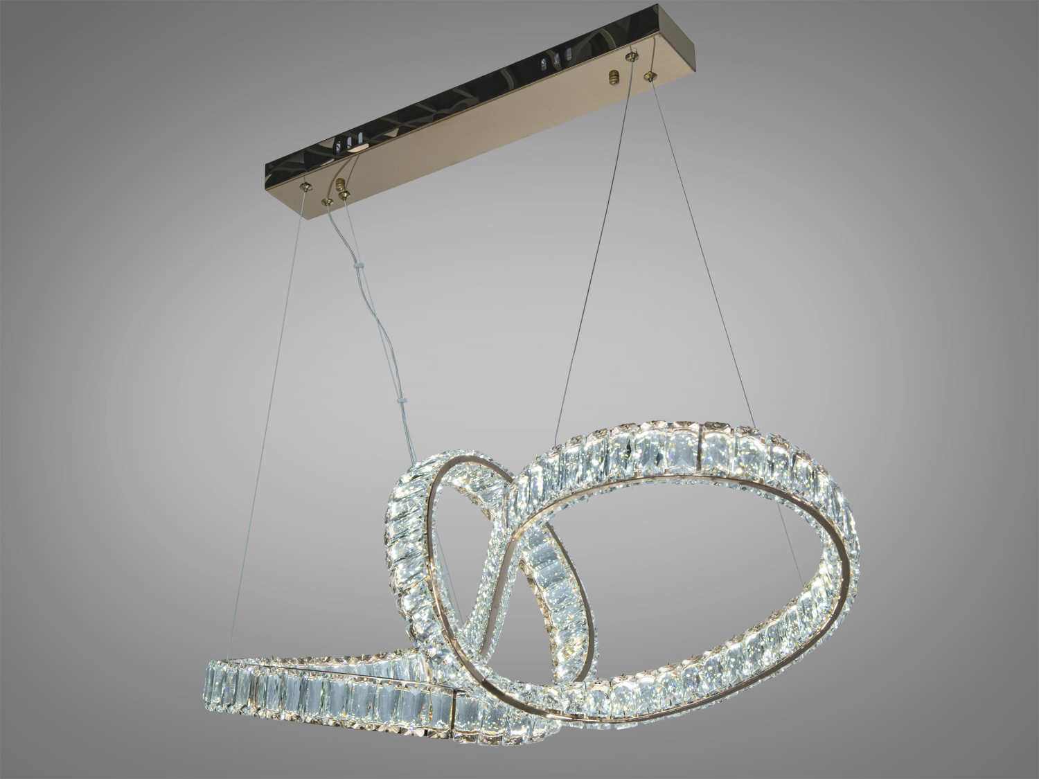 Підвісний світильник з двома кільцями, підвішеними на тонких тросах. Підходить для мінімалістичного інтер’єру.