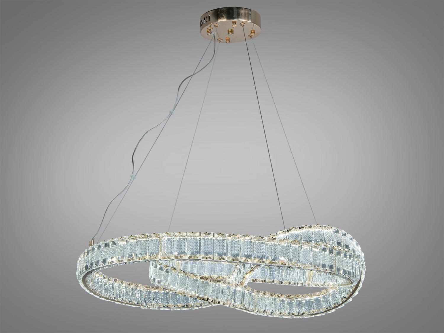 Підвісна люстра з переплетеними світлодіодними кільцями, підходить для монтажу в сучасних приміщеннях.