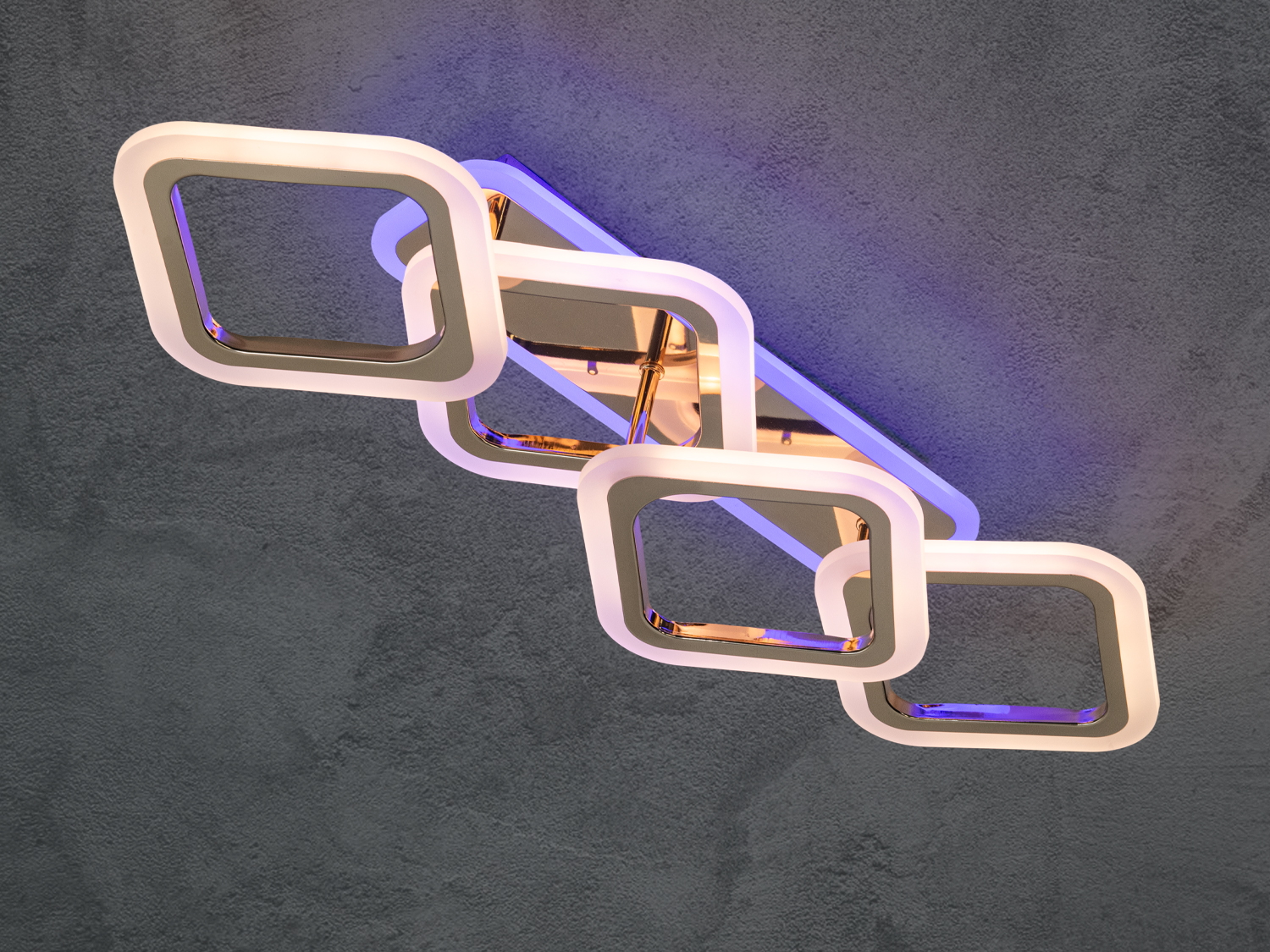 Світильник з квадратними плафонами, що випромінює синє підсвічування. Підходить для створення атмосфери в сучасних приміщеннях.