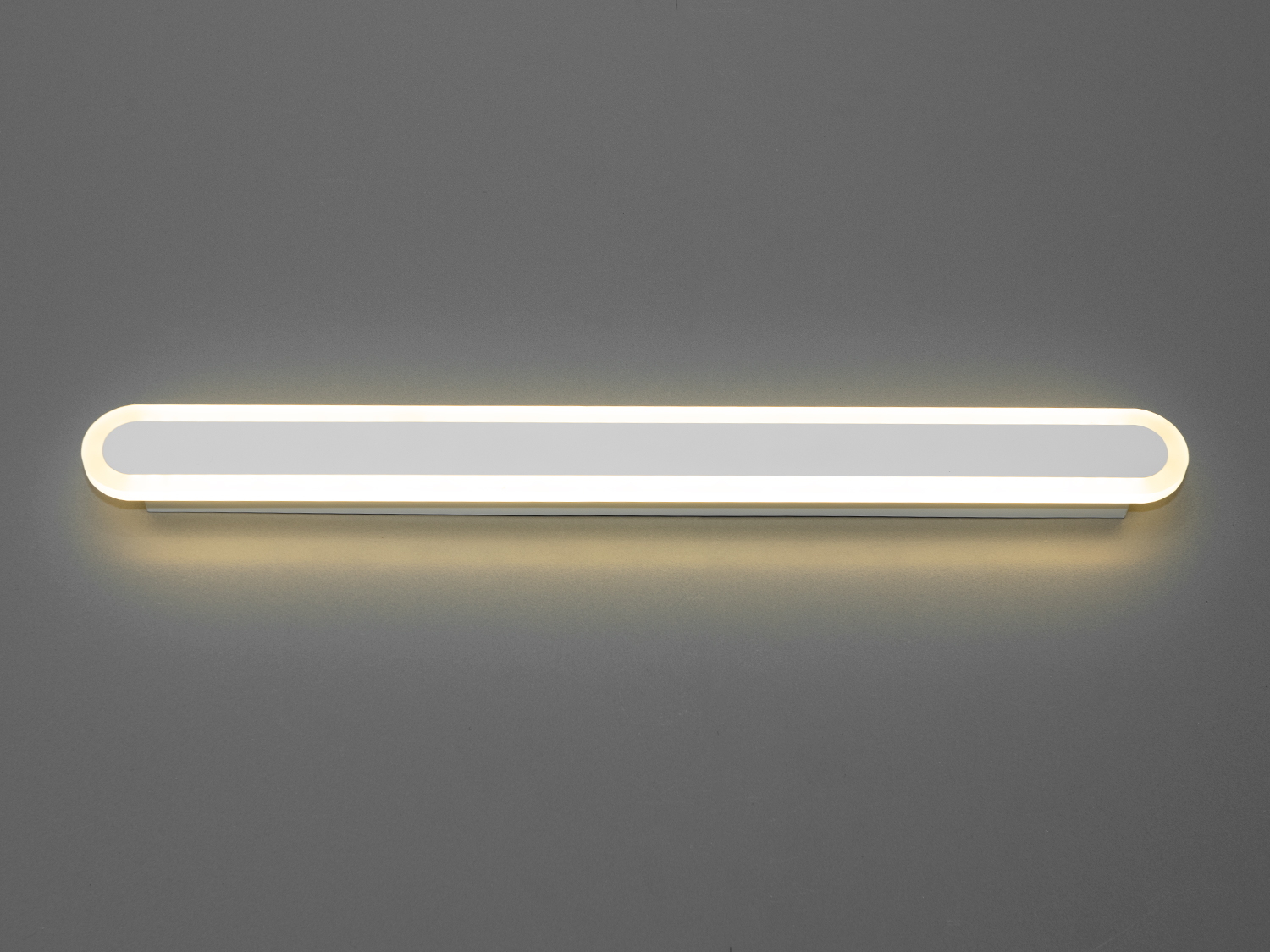 Світлодіодний світильник-планка на 30W відрізняється своєю унікальністю та сучасним дизайном. Він представляє собою елегантну і лаконічну лінію світла, яка ідеально підходить для створення чистого освітлення в будь-якому просторі, будь то спальня або кабінет. Його чисті, прямі лінії і мінімалістична естетика роблять його вишуканим доповненням до сучасного інтер'єру.
Світильник-бра складається з довгої світлодіодної панелі, обрамленої тонкою акриловою обідкою, що надає йому витонченого зовнішнього вигляду. Металева основа світильника має ненав'язливий білий матовий колір, що контрастує з яскравістю світлодіодів, створюючи візуальний інтерес і глибину. Відсутність видимих кріплень і кабелів посилює враження легкості та плавності дизайну.
Це  зовсім нове і незвичайне виконання плафонів із акрилу, що обрамляють LED стрічку. Таке бра запросто підійде під будь-який інтер'єр - класичний, сучасний і навіть в стилі «хай-тек». 
Ці світильники є ідеальним рішенням для акцентного (елементного) підсвічування в інтер'єрі - підсвічування дзеркал, картин, стінних ніш, особливих деталей інтер'єру. 
У даній серії всі світильники оснащені унікальними енергозберігаючими світлодіодними стрічками. Які за дуже низької споживаної потужності створюють потужний світловий потік. 
Витончені накладні світлодіодні світильники призначені для створення яскравого світлодіодного освітлення з регульованою температурою кольору від теплого білого до холодного білого. 
Перемикання спектрів світіння світлодіодним панелі здійснюється простим вимиканням-включенням.
Світлодіодний світильник дозволяє вибирати режими освітлення в залежності від часу доби.
Вони створені щоб бути окрасою інтер'єру, а не просто утилітарним світильником як звичайне лінійне підсвічування.
Кріпиться до будь-яких видів поверхонь універсальним кріпленням-на планку.