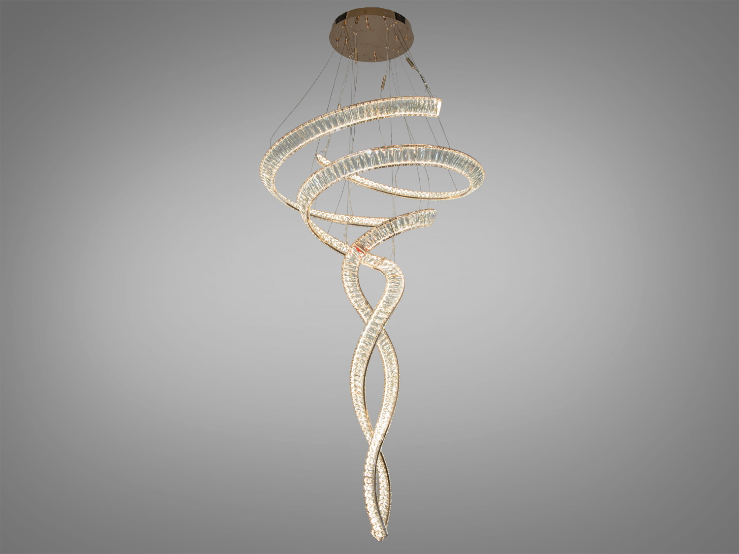 Підвісна люстра зі спіральним дизайном, підходить для сучасного інтер’єру. Виконана з прозорих матеріалів, створює м’яке освітлення.