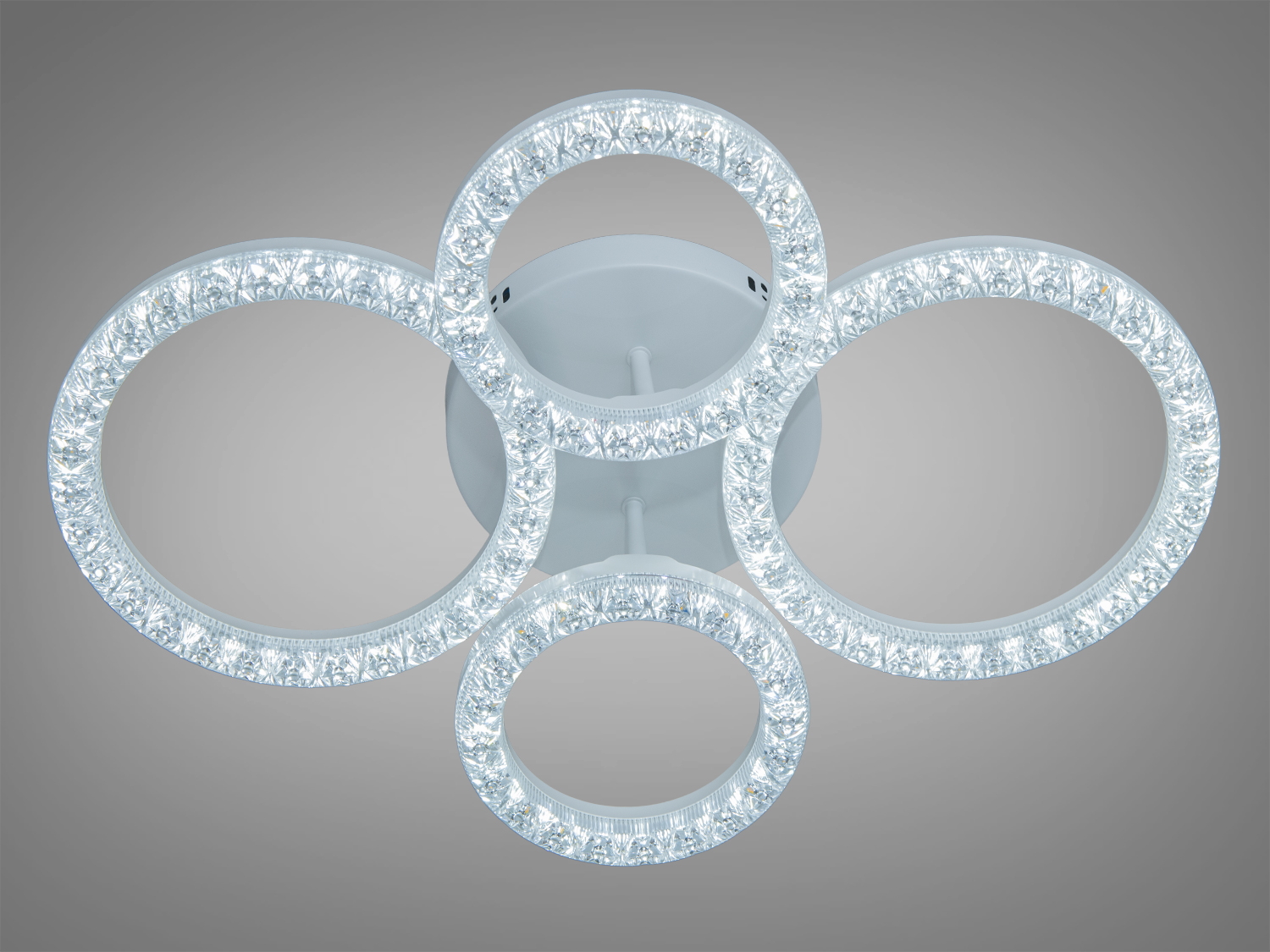 Стельовий світильник з чотирма кільцями, що світяться, з кришталевими елементами. Ідеальний для освітлення вітальні.