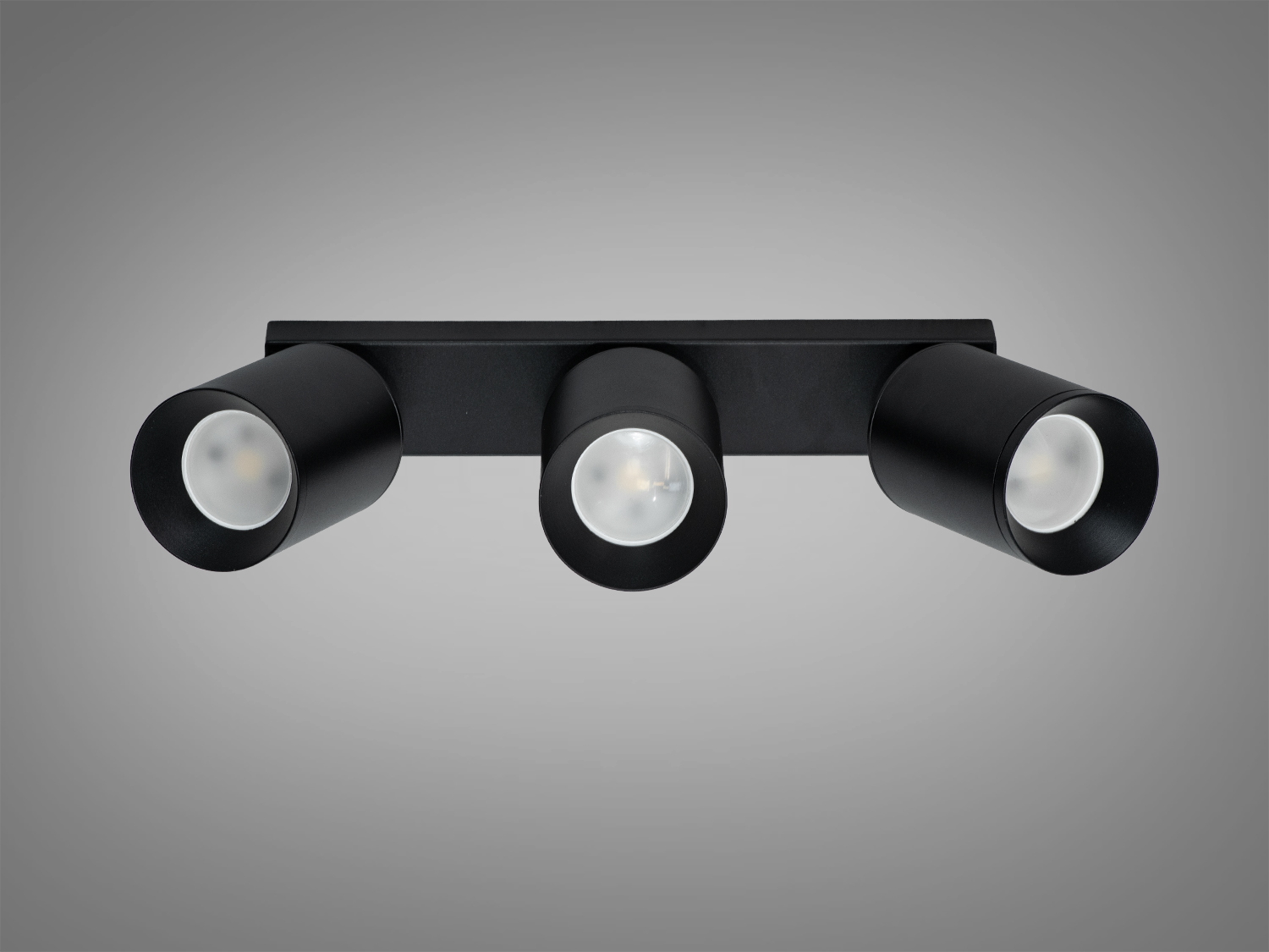 Чорний світильник з трьома нерухомими циліндричними лампами для рівномірного освітлення, підходить для офісних приміщень.