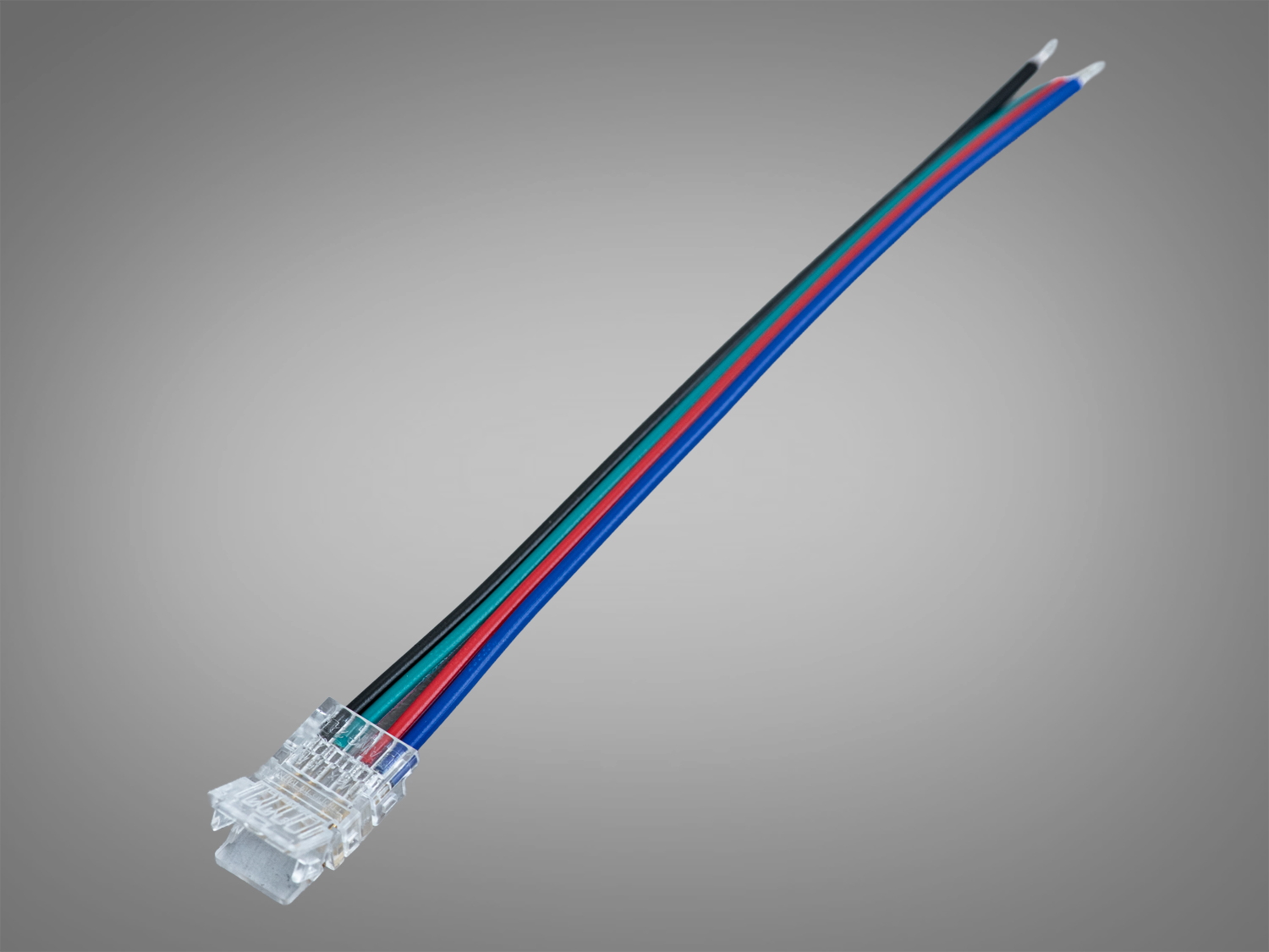 Прозорий роз′єм з чотирма кольоровими проводами для підключення LED стрічок. Підходить для монтажу в інтер′єрах з різноманітним освітленням.