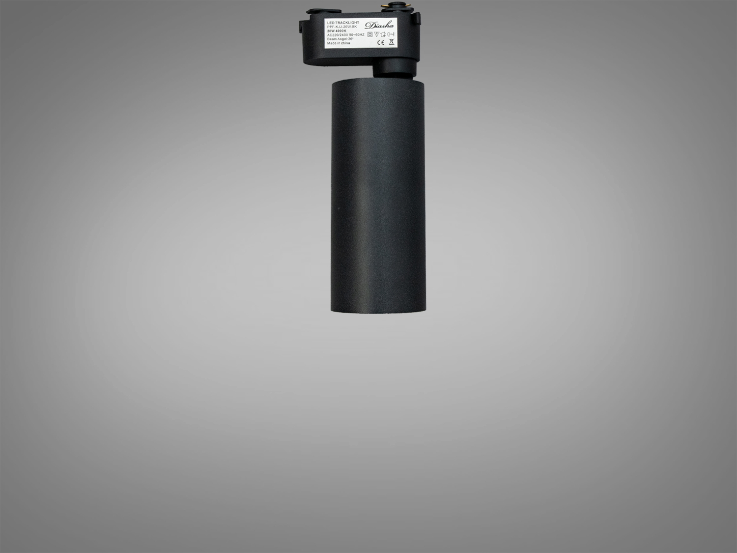 Вертикально встановлений чорний трековий світильник циліндричної форми, підходить для освітлення вітрин.