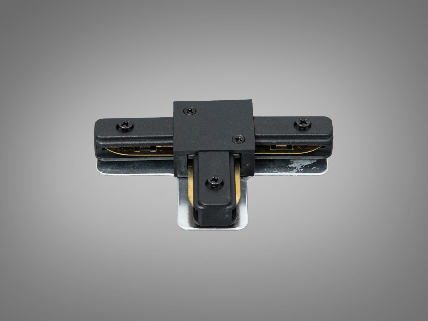 Т-подібний накладний з’єднувач серії 1209 у чорному кольорі для створення Т-розгалужень у трековому освітленні. Сумісність зі стандартним профілем 48 В за умови відповідності.