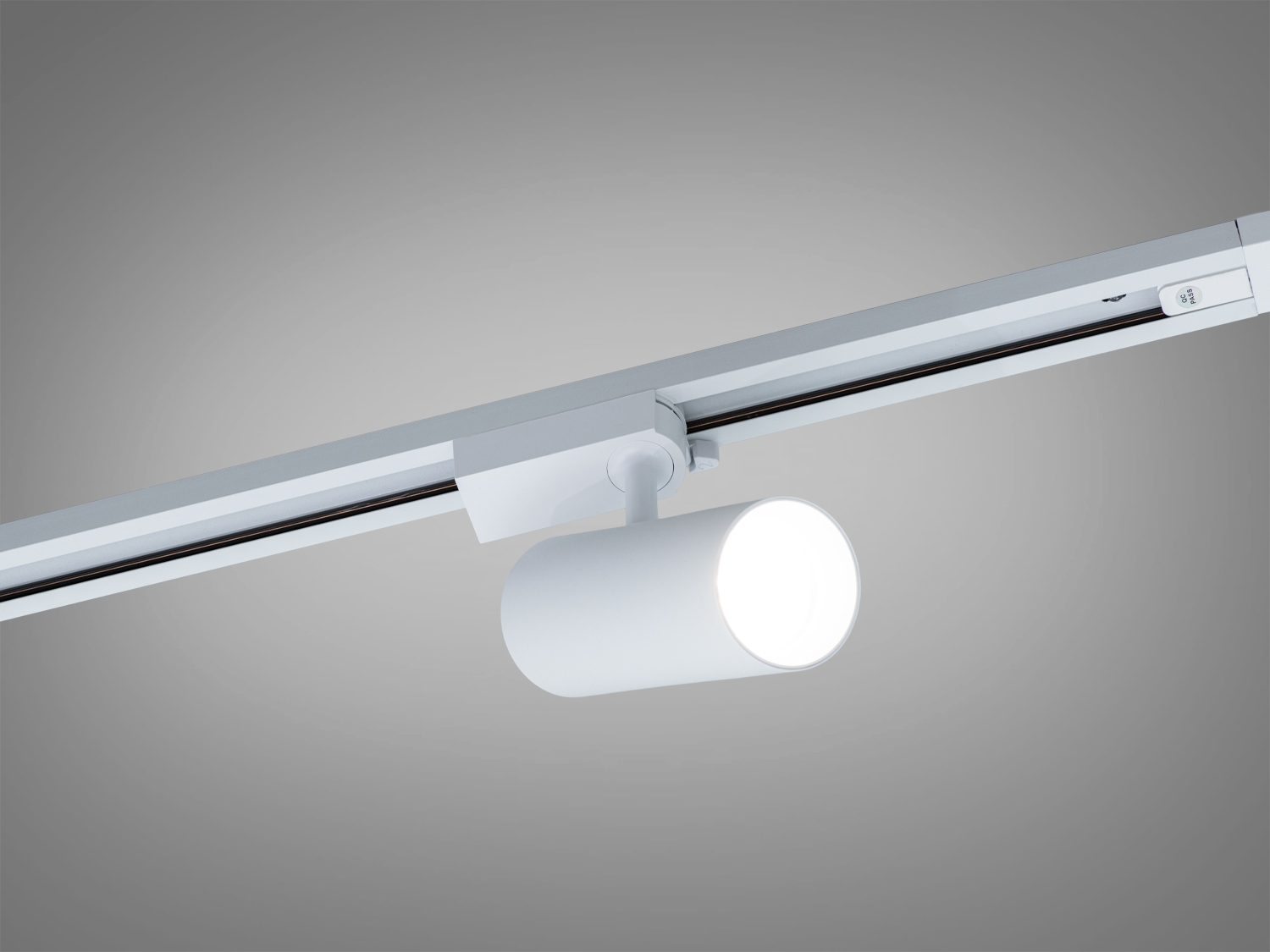 Білий циліндричний трековий LED-світильник 20 Вт для систем 220 В. Рухоме спрямування променя, просте переміщення по рейці, для акцентного освітлення у комерційних і житлових просторах.