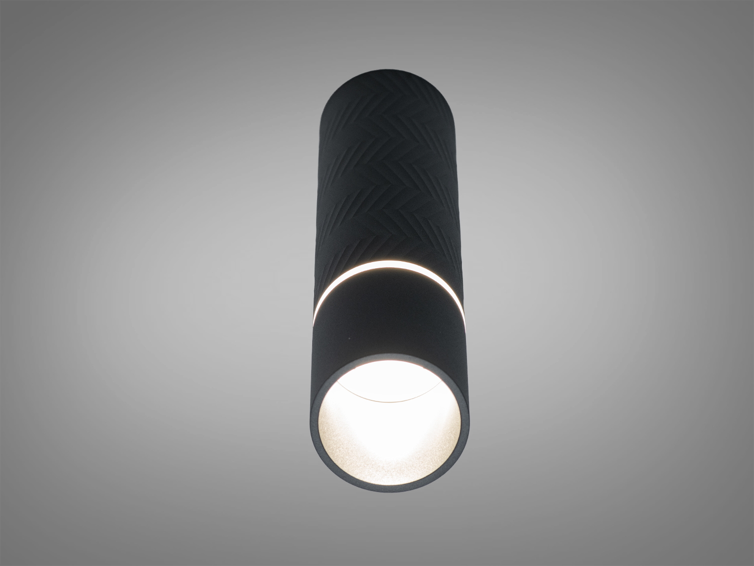 Чорний циліндричний світильник із внутрішнім світлом, підходить для стельового монтажу. Текстурована поверхня додає стилю.