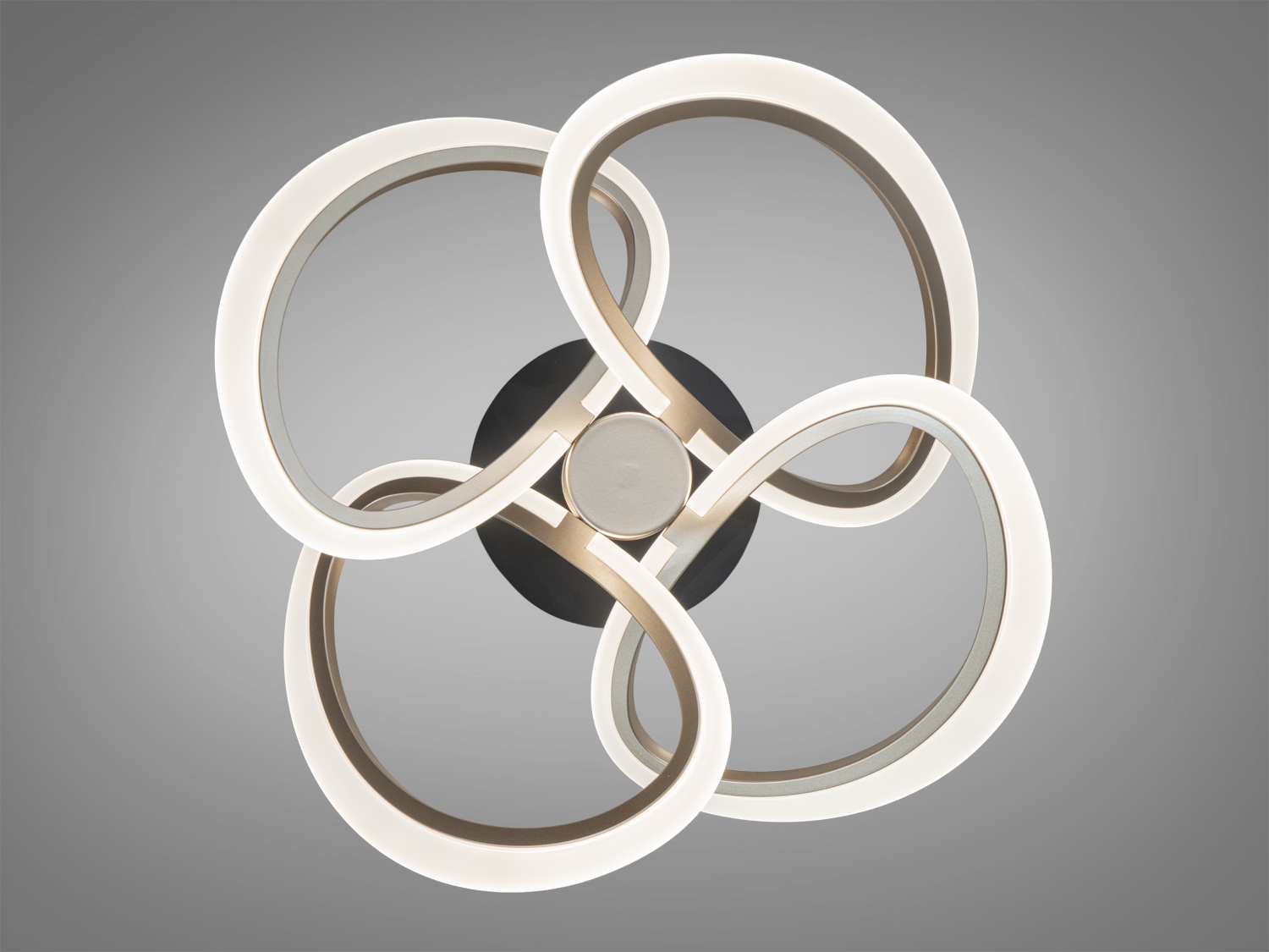 Світильник з чотирма кільцями, розташованими у формі квітки. Випромінює м’яке тепле світло, ідеально для вітальні.