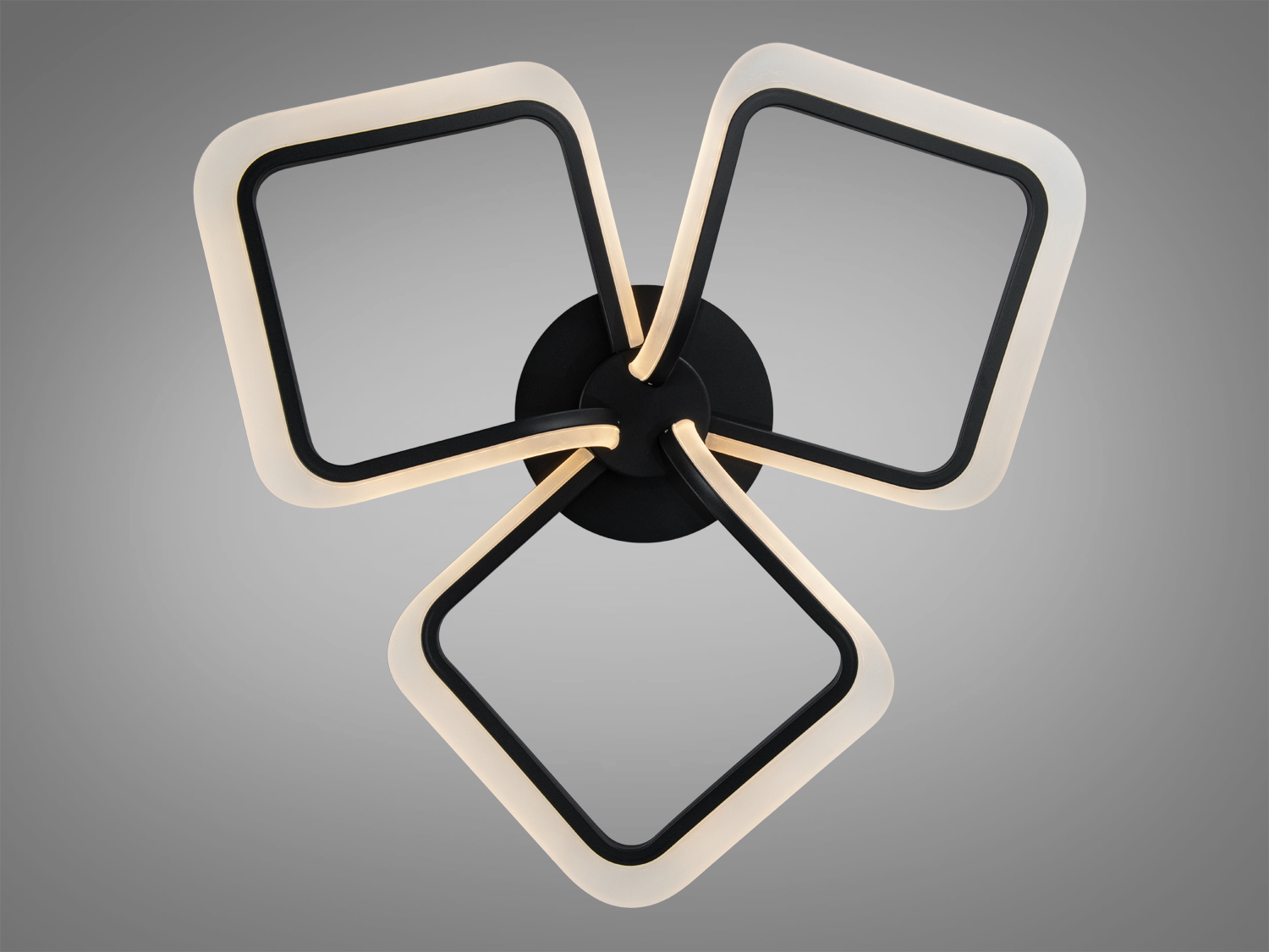 Світильник із трьома квадратними LED-елементами, що кріпляться на чорній основі, підходить для сучасного інтер’єру.