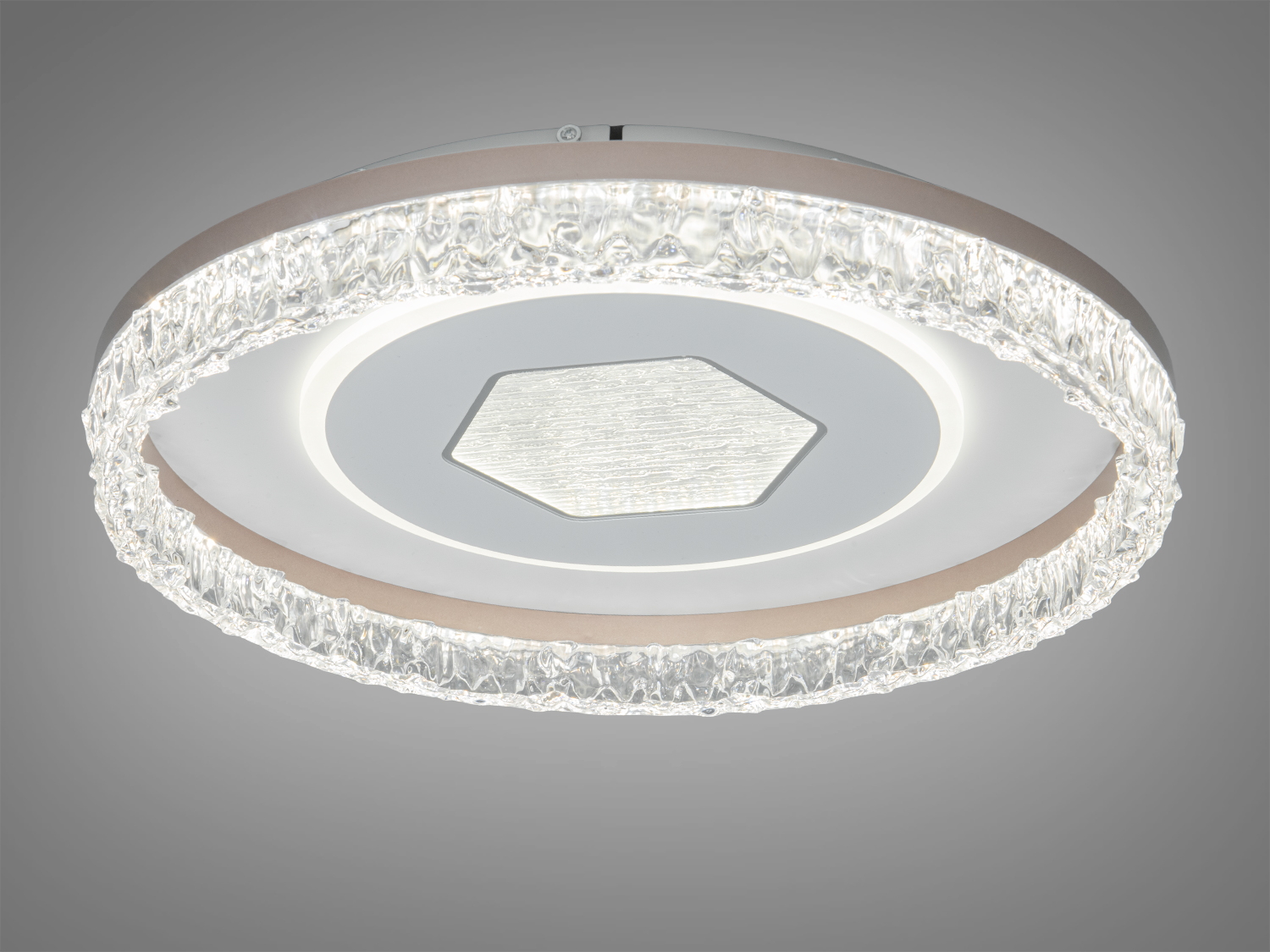 Стельова лампа з текстурованим шестикутним центром та прозорим обрамленням, ідеальна для монтажу в сучасних приміщеннях.