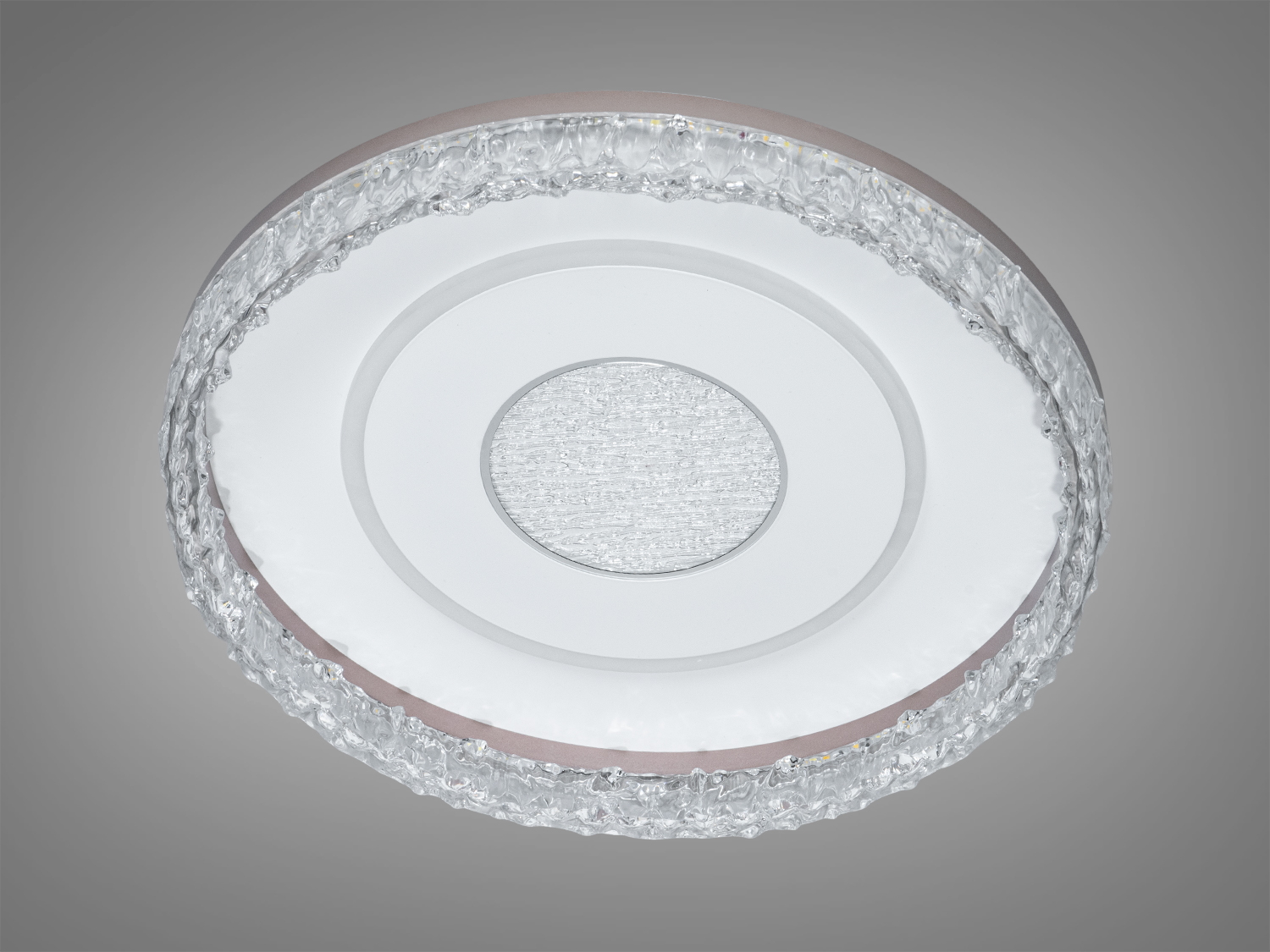 Кругла лампа для стелі з матовим центром та прозорим рельєфним краєм. Ідеально підходить для освітлення вітальні або спальні.